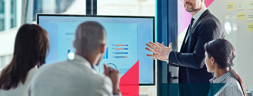 a man is giving a presentation to a group of people