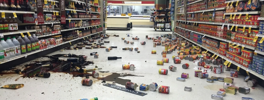 a blurred image of a store with a lot of trash on the floor