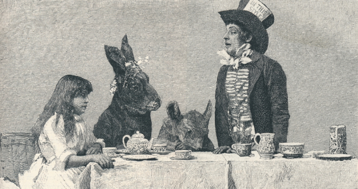 a man in a mad hatter costume talks to two rabbits and a woman