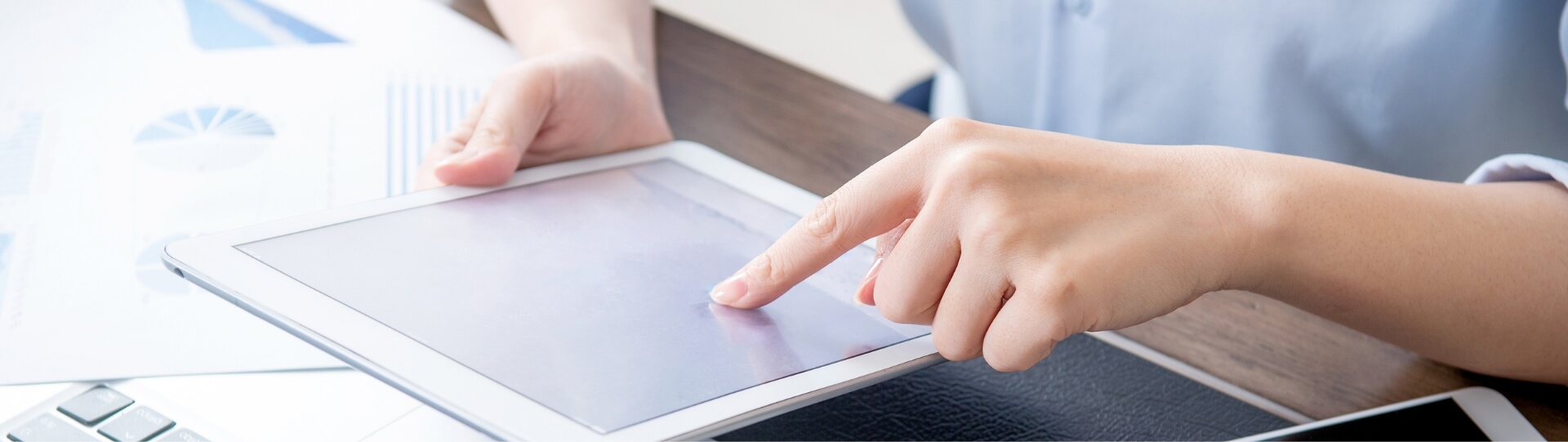 a person is using a tablet with their finger on the screen