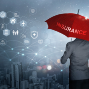 a man holding a red umbrella that says insurance