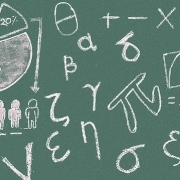 a green chalkboard with various mathematical symbols drawn on it